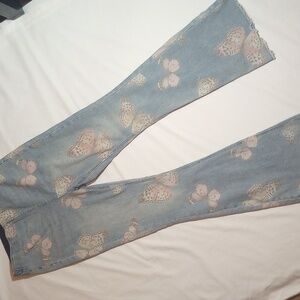 Super cute high waisted bell bottom jeans with butterflies all over them